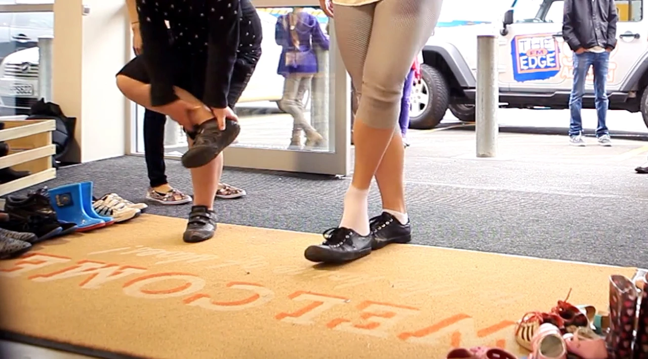 Hundreds shop barefoot at store launch